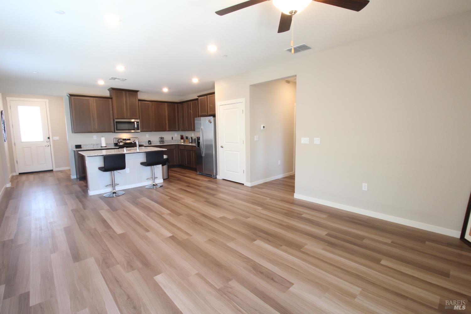 2283 Revival Lane Rio Vista, CA 94571 - Photo 10 of 44 a kitchen with kitchen island white cabinets and stainless steel appliances
