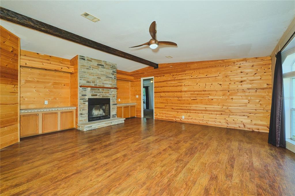 2701 Murphy Road Ona, FL 33865 - Photo 9 of 41 a view of a livingroom with wooden floor a ceiling fan and window