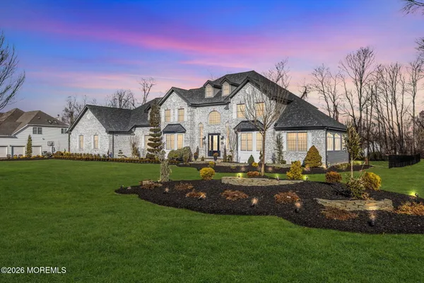 a front view of a house with garden