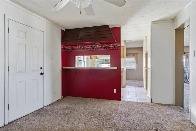 a white toilet sitting next to a bath tub