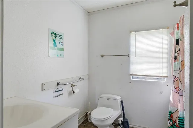 an empty room with closet and mirror