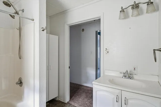 a view of an empty room with windows