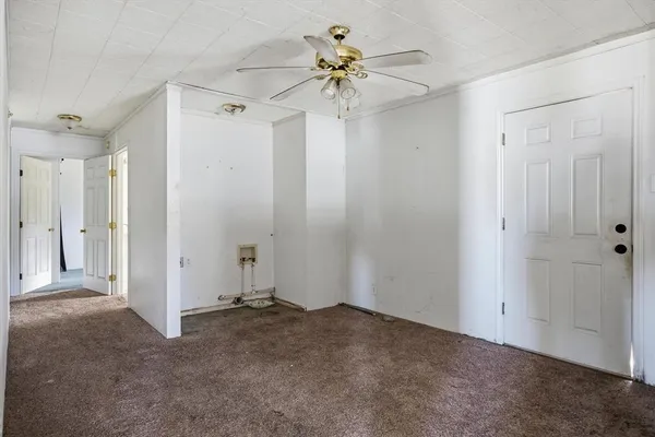 a view of an empty room with a window