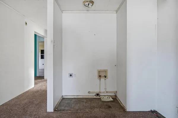 an empty room with closet and mirror