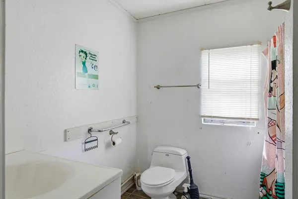 a view of an empty room with windows