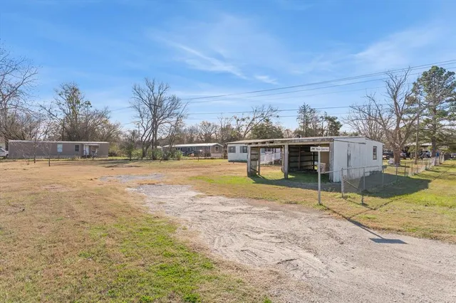 a house with trees in the background