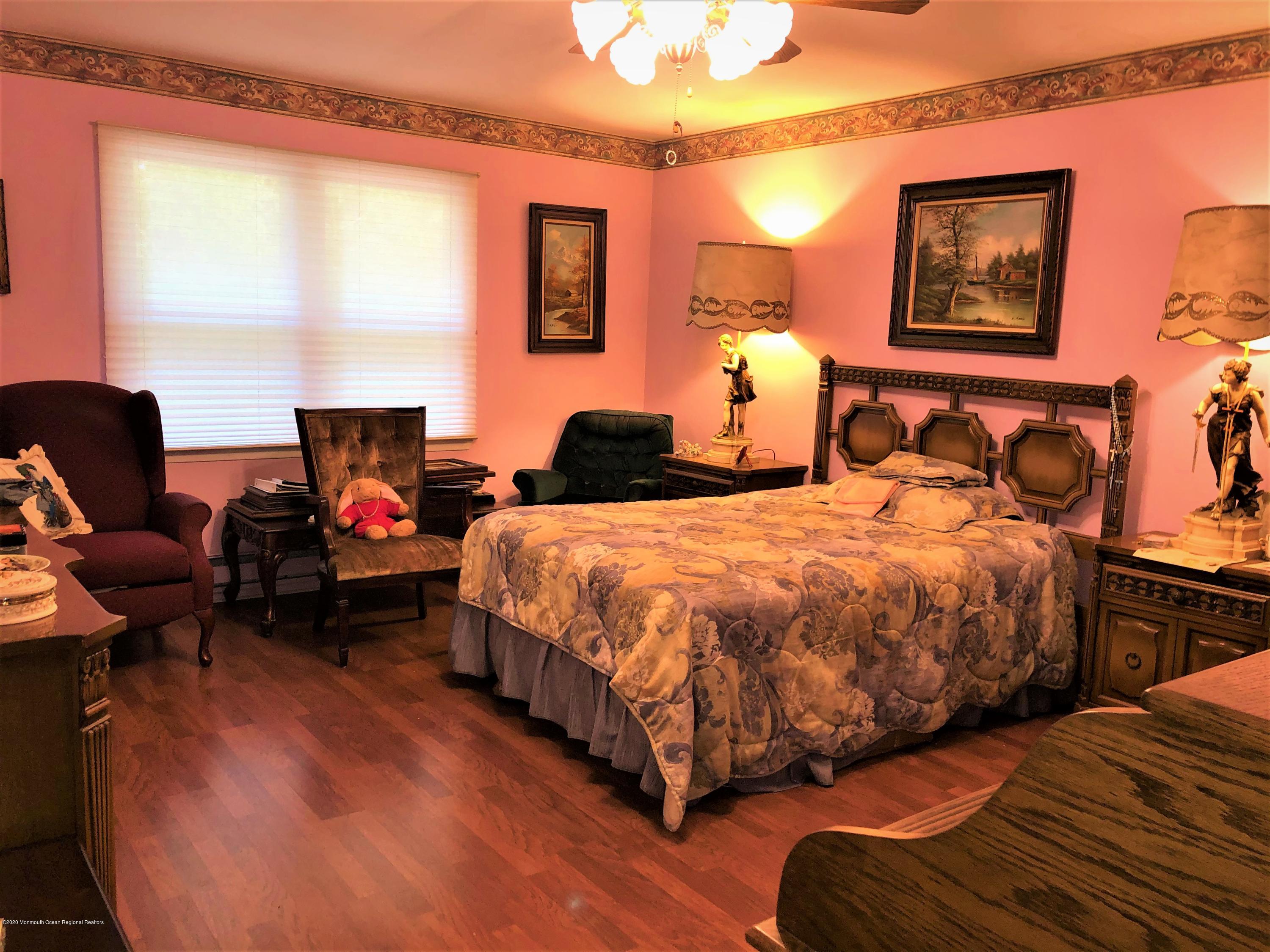 22 Abbey Road Brick, NJ 08723 - Photo 15 of 22 a spacious bedroom with two beds and a window