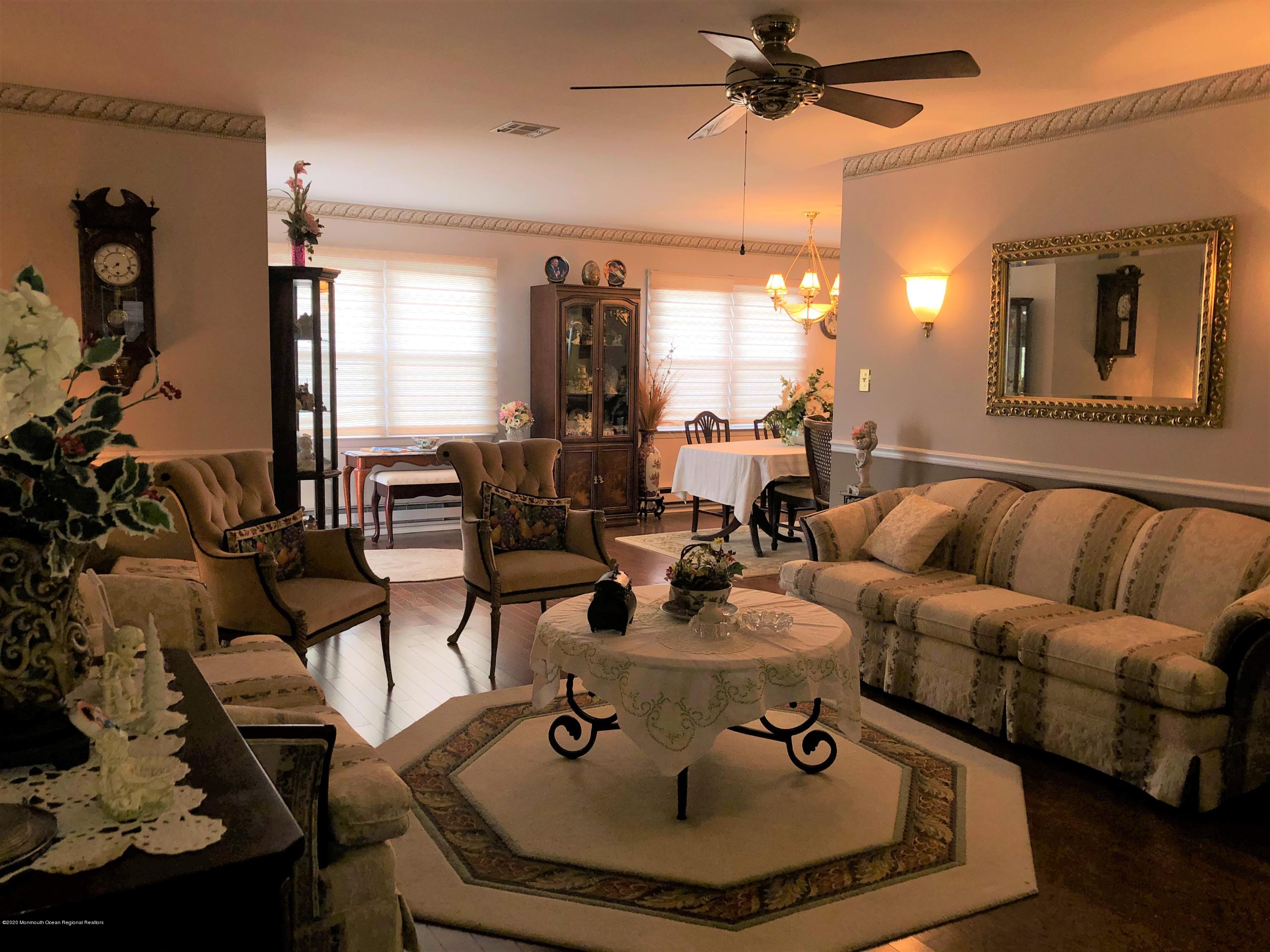 22 Abbey Road Brick, NJ 08723 - Photo 3 of 22 a living room with furniture and a chandelier