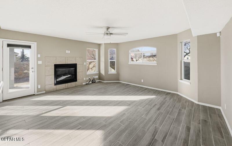 533 Flanagan Place El Paso, TX 79928 - Photo 13 of 52 an empty room with windows and fireplace