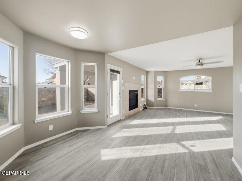 533 Flanagan Place El Paso, TX 79928 - Photo 17 of 52 a view of an empty room with wooden floor and a window