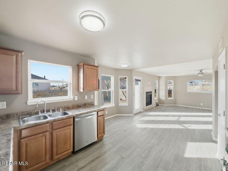 533 Flanagan Place El Paso, TX 79928 - Photo 20 of 52 a large white kitchen with a sink and dishwasher with a large window
