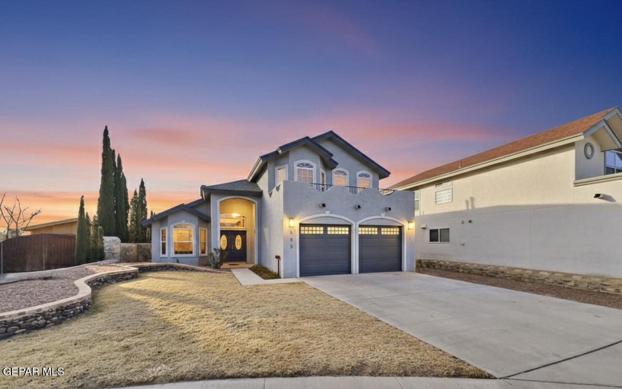 533 Flanagan Place El Paso, TX 79928 - Photo 2 of 52 a front view of a house with a yard