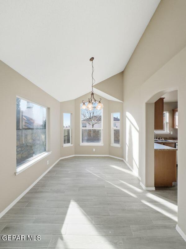 533 Flanagan Place El Paso, TX 79928 - Photo 22 of 52 a view of an empty room with a window and kitchen view