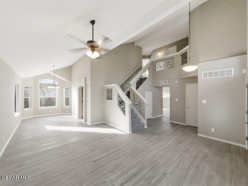 533 Flanagan Place El Paso, TX 79928 - Photo 24 of 52 a view of an empty room with wooden floor and a ceiling fan