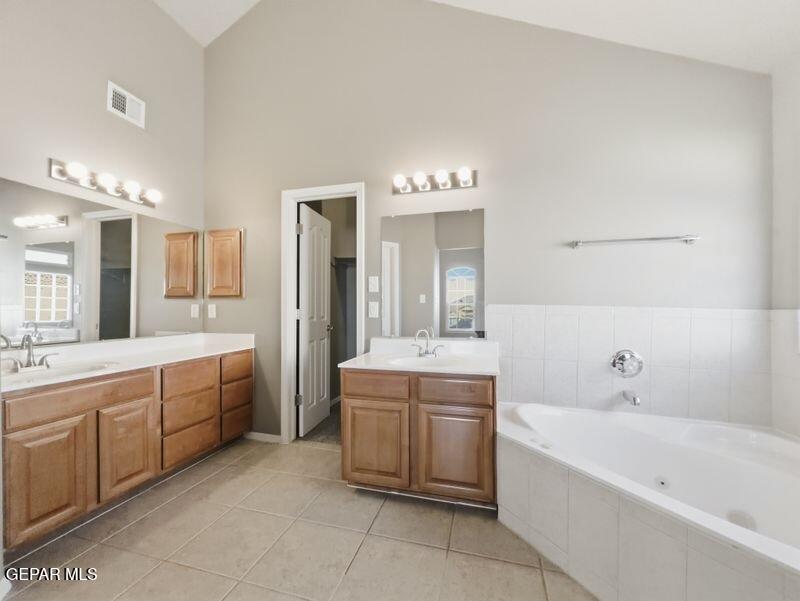533 Flanagan Place El Paso, TX 79928 - Photo 29 of 52 a large bathroom with a large tub double vanity sink and