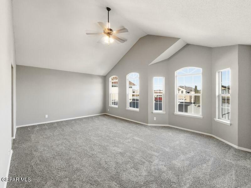 533 Flanagan Place El Paso, TX 79928 - Photo 33 of 52 an empty room with chandelier fan and windows
