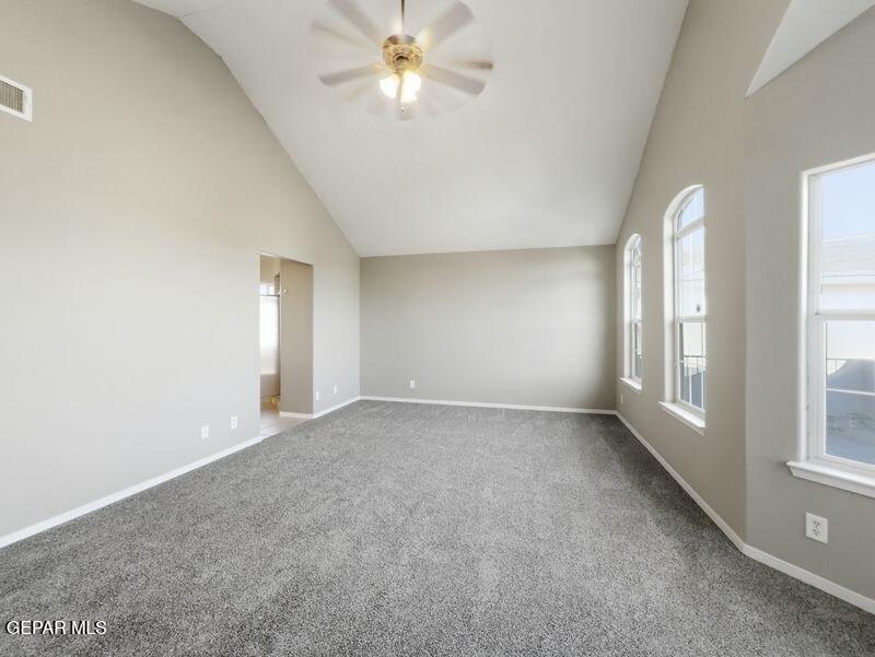 533 Flanagan Place El Paso, TX 79928 - Photo 34 of 52 an empty room with windows and chandelier fan
