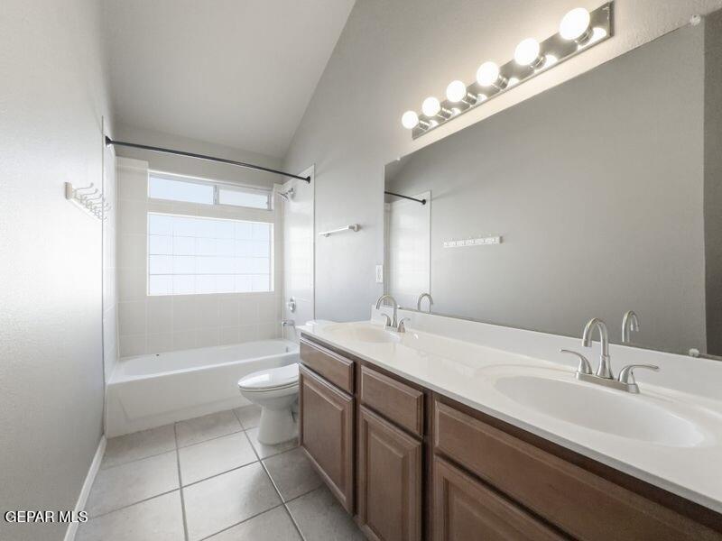 533 Flanagan Place El Paso, TX 79928 - Photo 39 of 52 a bathroom with a sink a toilet a mirror and shower