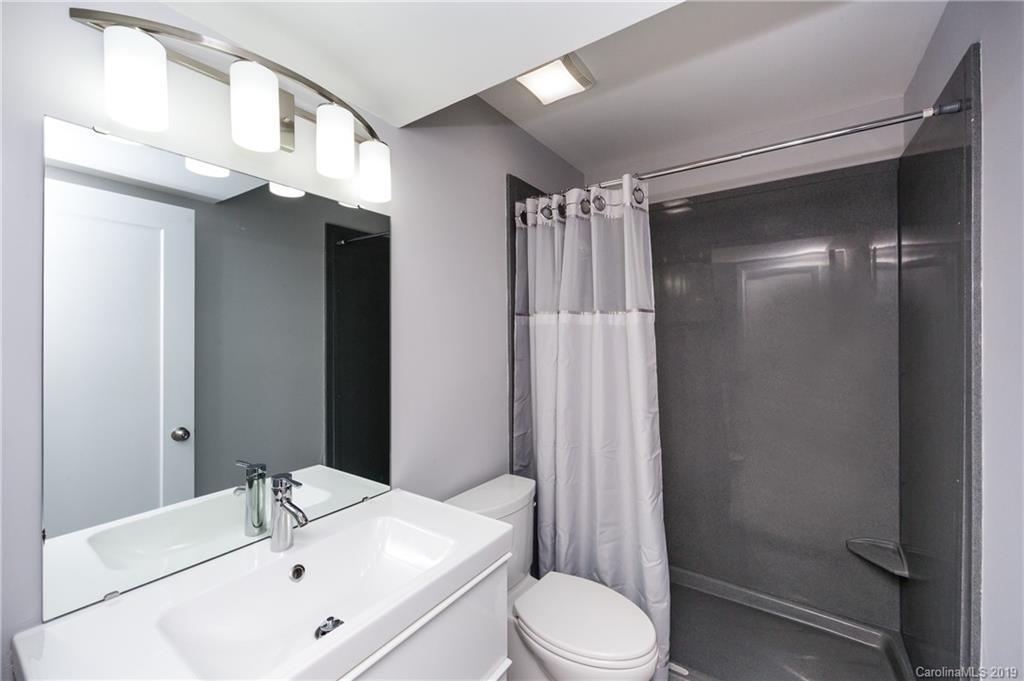 11077 Running Ridge Road Charlotte, NC 28226 - Photo 18 of 21 a bathroom with a sink toilet and shower