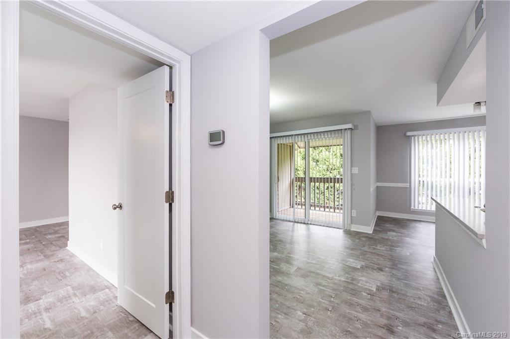 11077 Running Ridge Road Charlotte, NC 28226 - Photo 3 of 21 a view of an empty room with wooden floor and a window