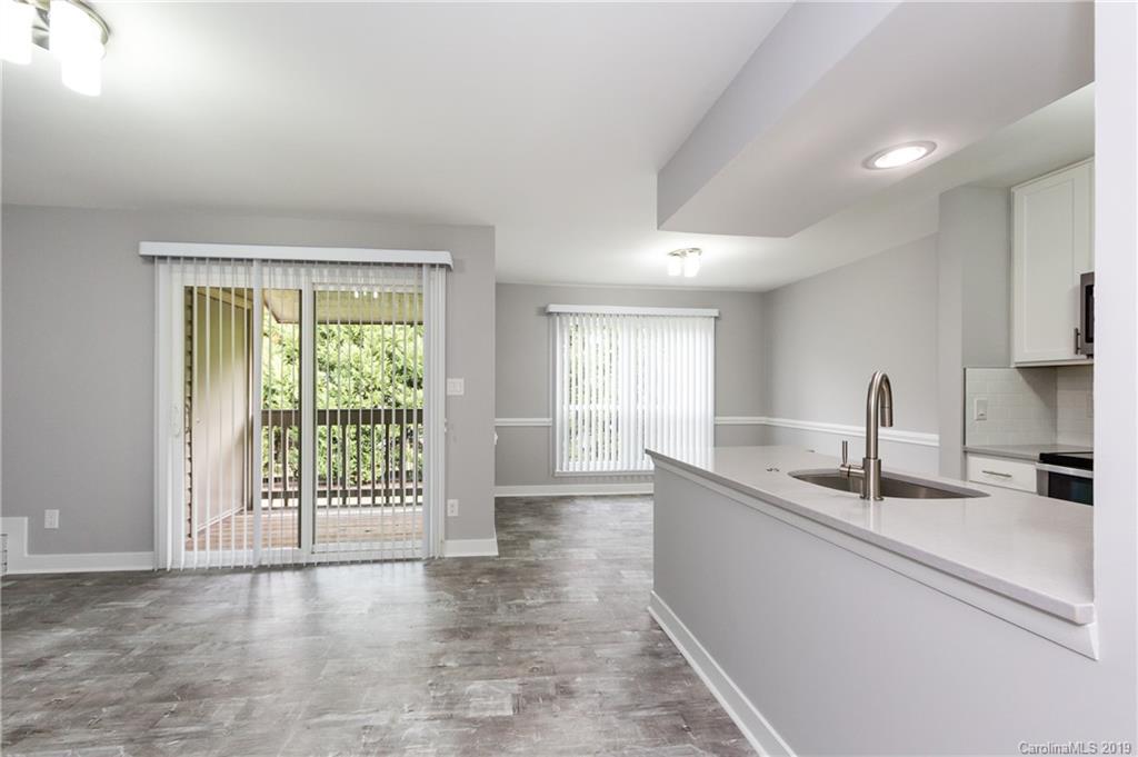 11077 Running Ridge Road Charlotte, NC 28226 - Photo 4 of 21 a kitchen with granite countertop a sink and a window