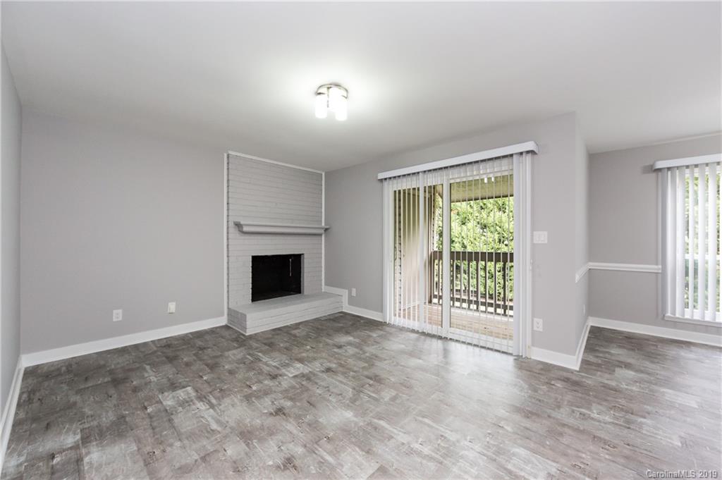 11077 Running Ridge Road Charlotte, NC 28226 - Photo 5 of 21 a view of an empty room with a window and fireplace