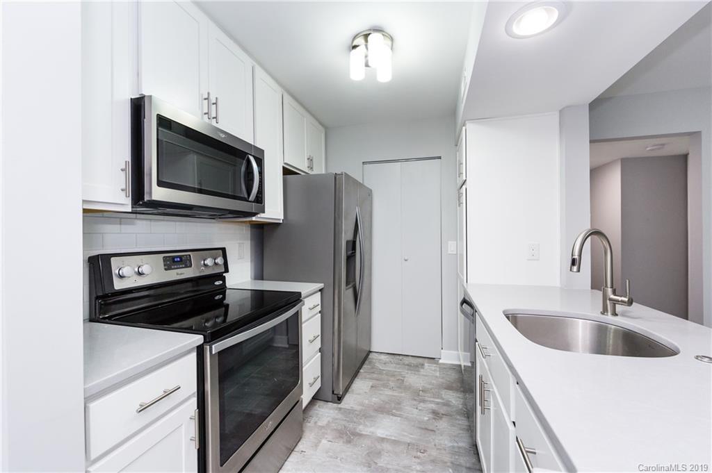 11077 Running Ridge Road Charlotte, NC 28226 - Photo 7 of 21 a kitchen with a sink stove and microwave