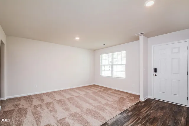 a view of an empty room and window