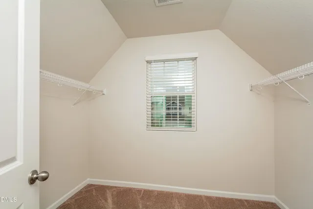 a view of a room that has a window in it