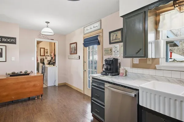 a room with wooden floor and window