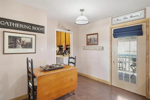 a view of a livingroom with furniture and wooden floor
