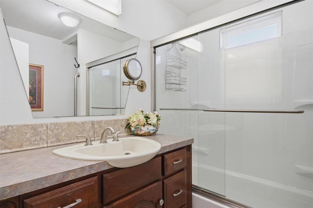 126 4th Street Tuscola, TX 79562 - Photo 22 of 31 a bathroom with a sink and a mirror