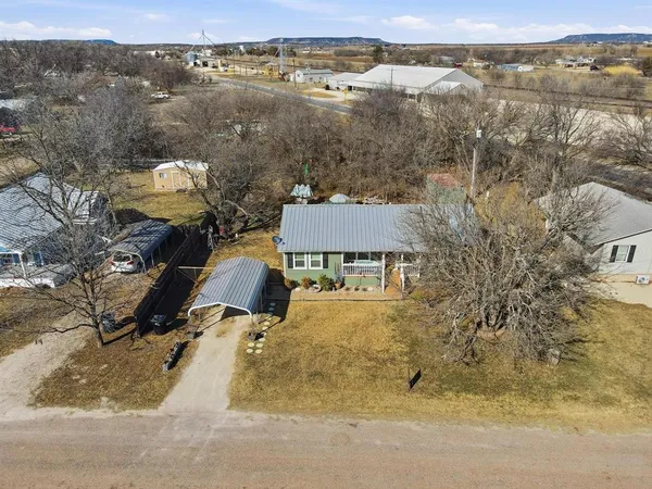 an aerial view of houses with yard