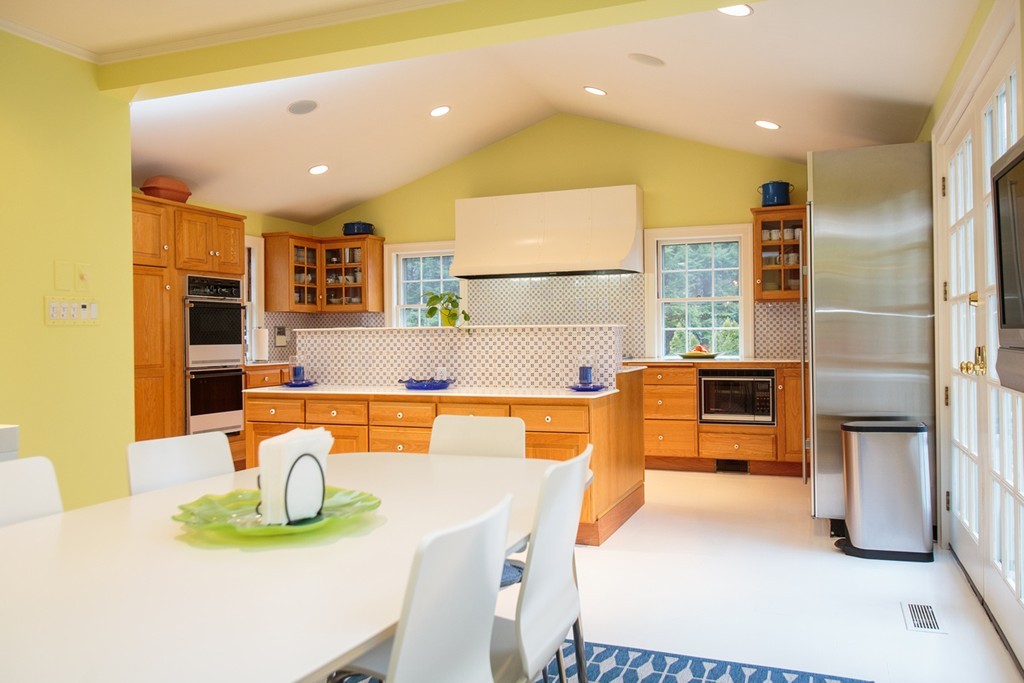 65 Arnold Road Wellesley, MA 02481 - Photo 15 of 17 a kitchen with stainless steel appliances granite countertop a sink and a refrigerator