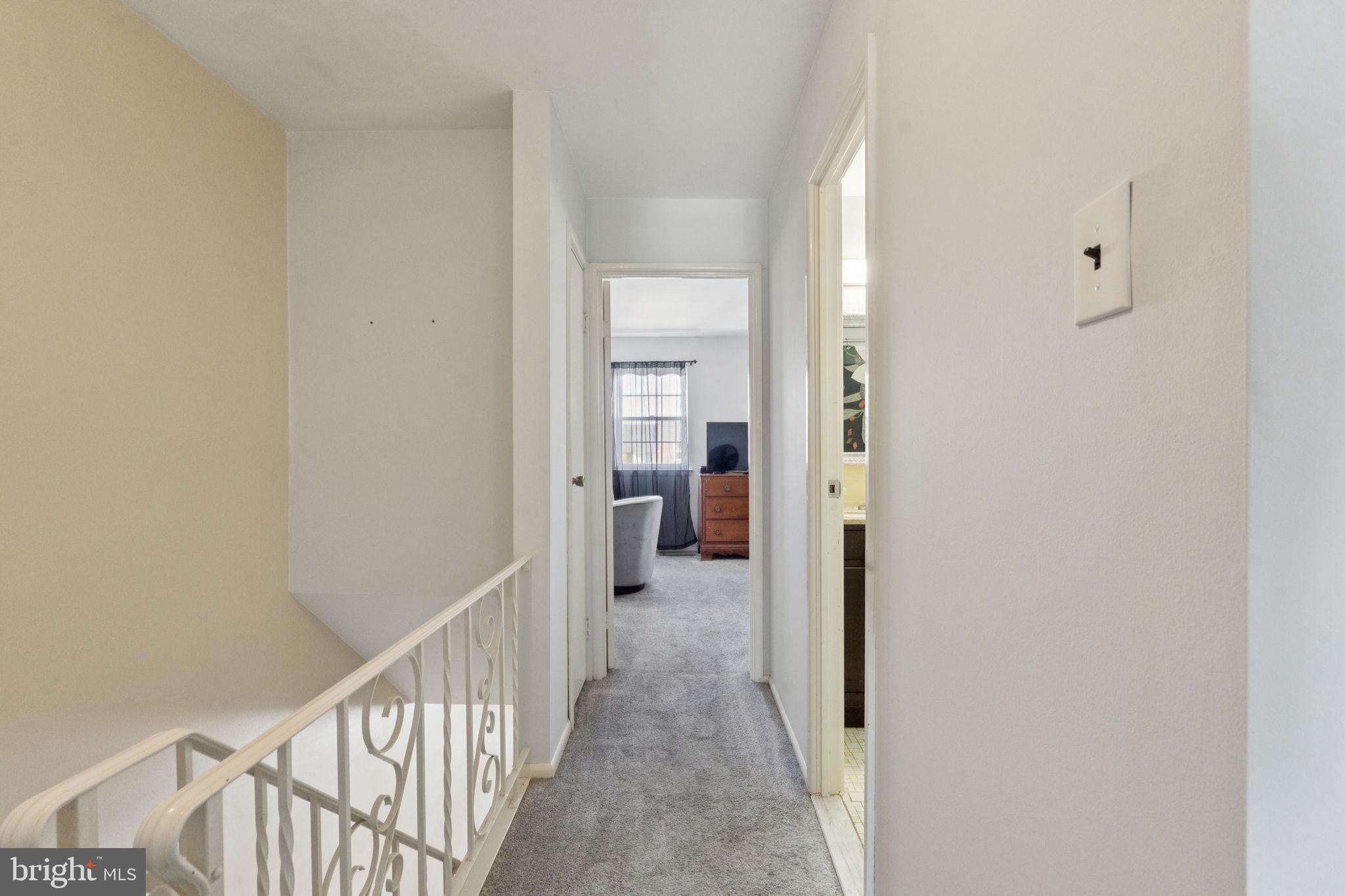 3978 Stevenson Street Philadelphia, PA 19114 - Photo 17 of 25 a view of a hallway with a livingroom and a bathroom