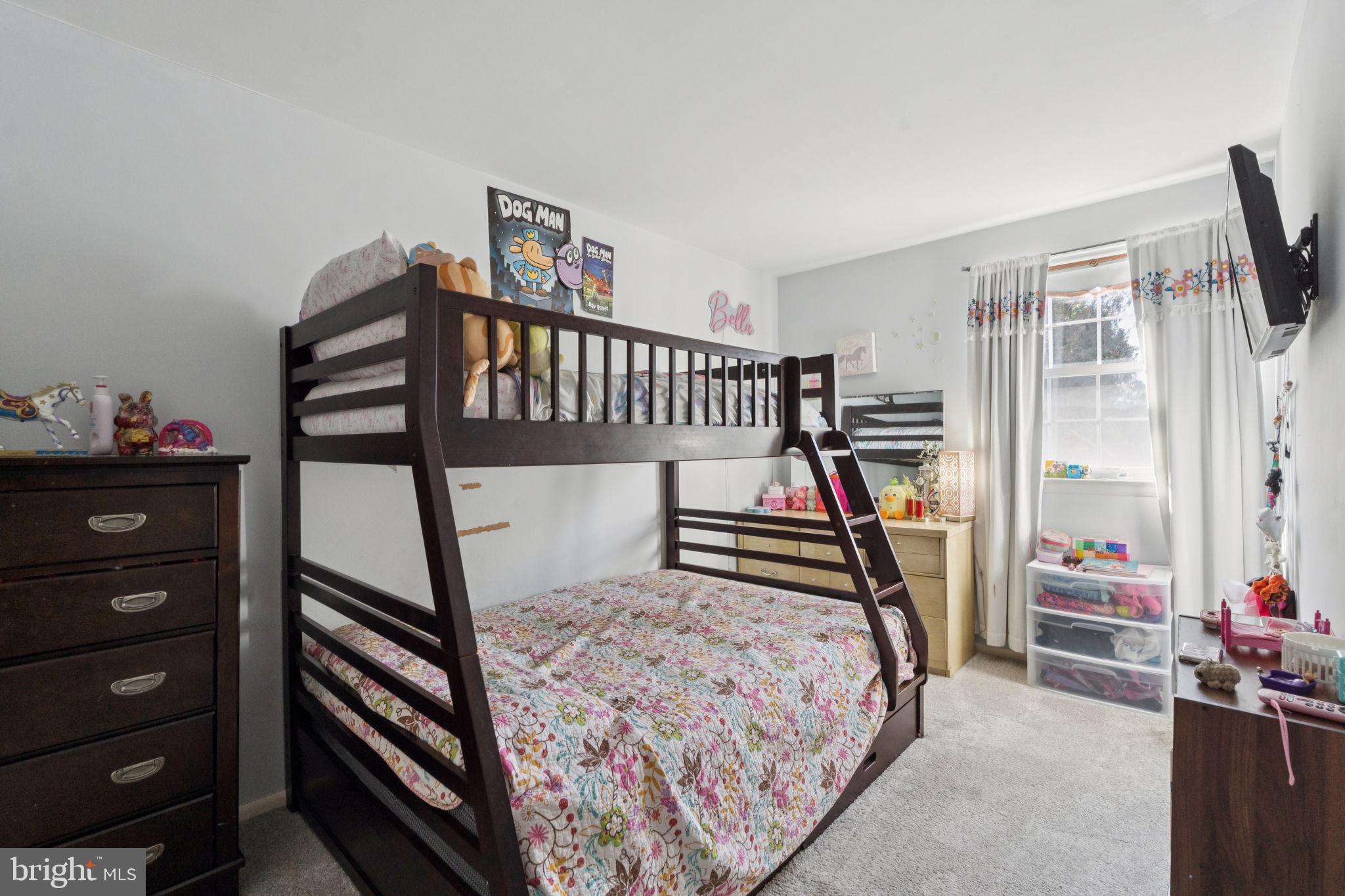 3978 Stevenson Street Philadelphia, PA 19114 - Photo 19 of 25 a bedroom with furniture and a window