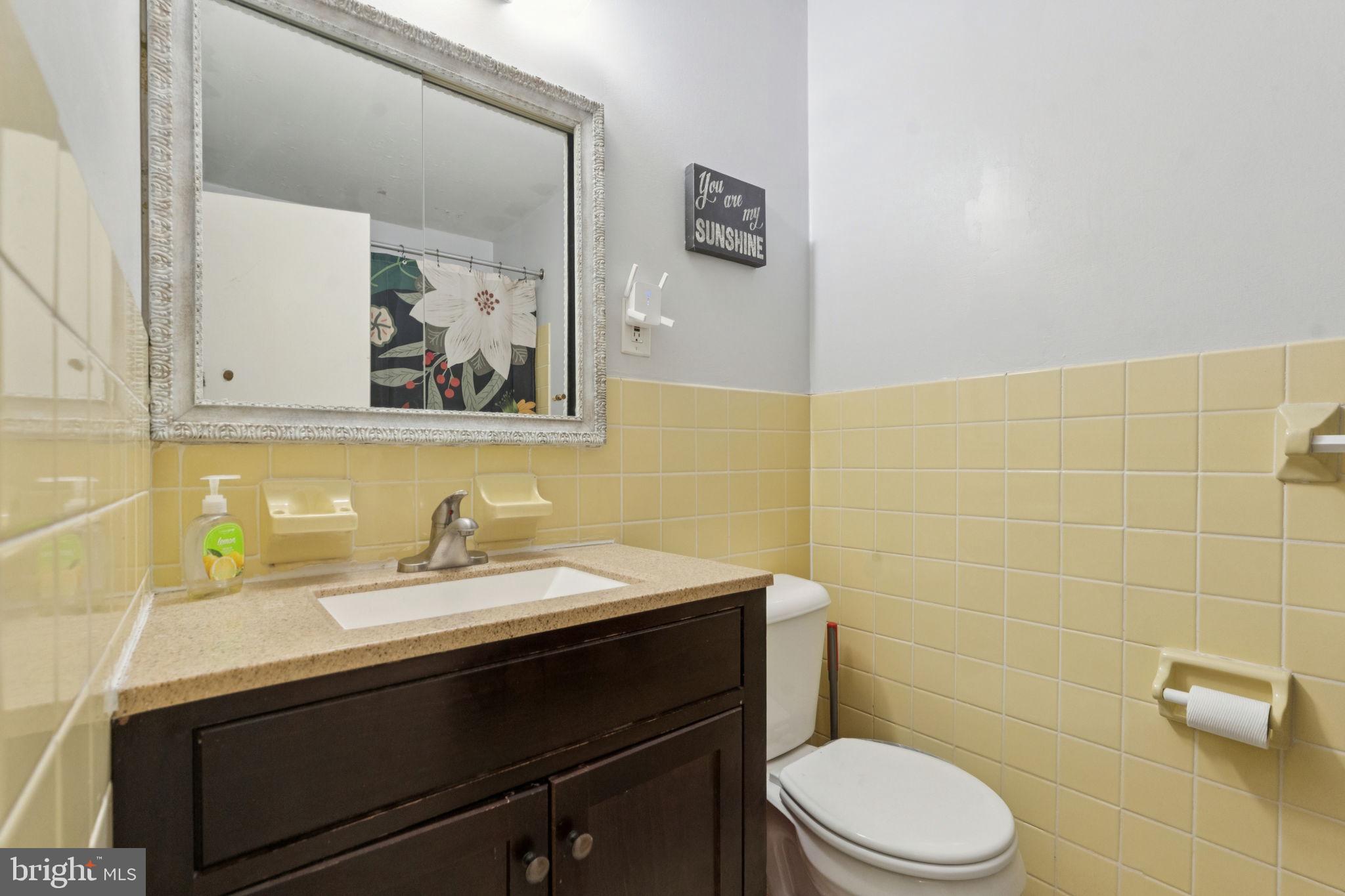 3978 Stevenson Street Philadelphia, PA 19114 - Photo 21 of 25 a bathroom with a sink toilet and vanity