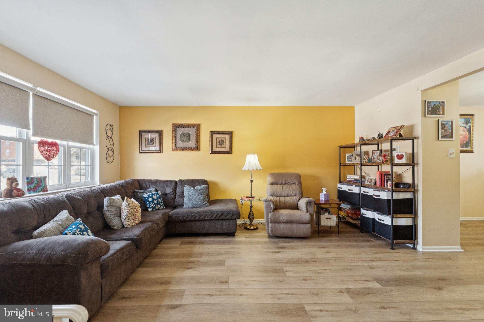 3978 Stevenson Street Philadelphia, PA 19114 - Photo 6 of 25 a living room with furniture and a flat screen tv