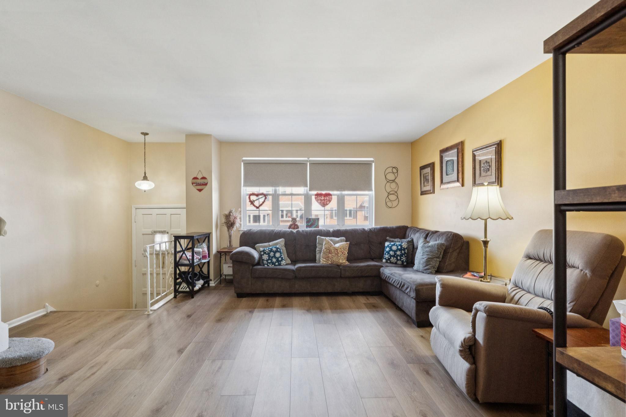 3978 Stevenson Street Philadelphia, PA 19114 - Photo 7 of 25 a living room with furniture and a wooden floor