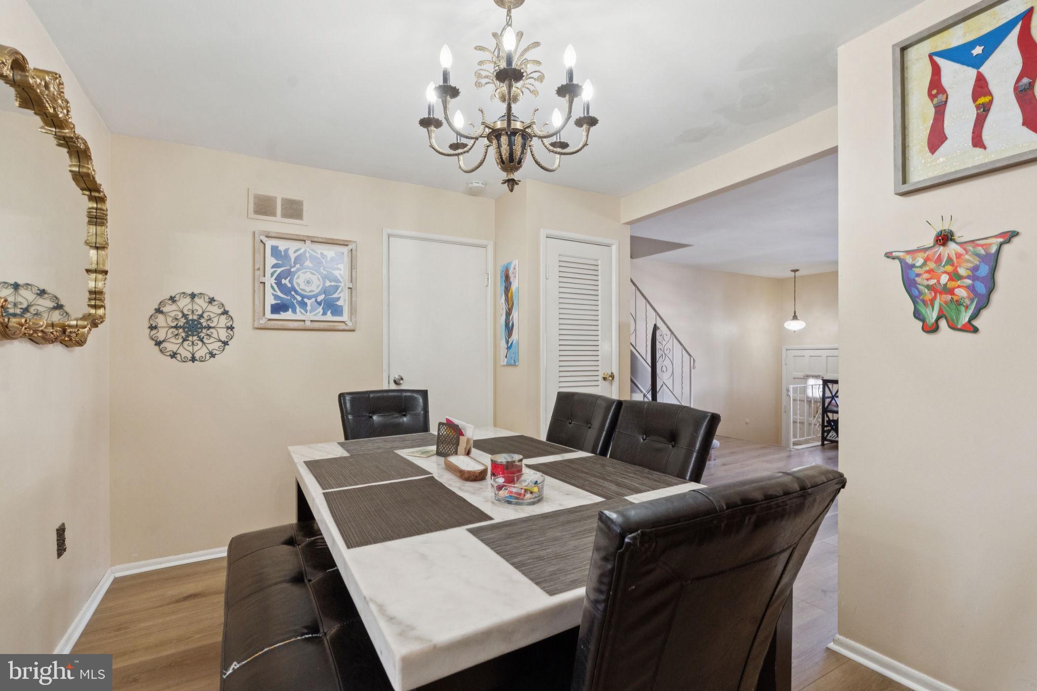 3978 Stevenson Street Philadelphia, PA 19114 - Photo 8 of 25 a view of a dining room with furniture and wooden floor