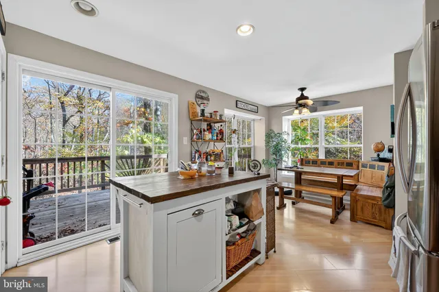 a room with a large window and furniture