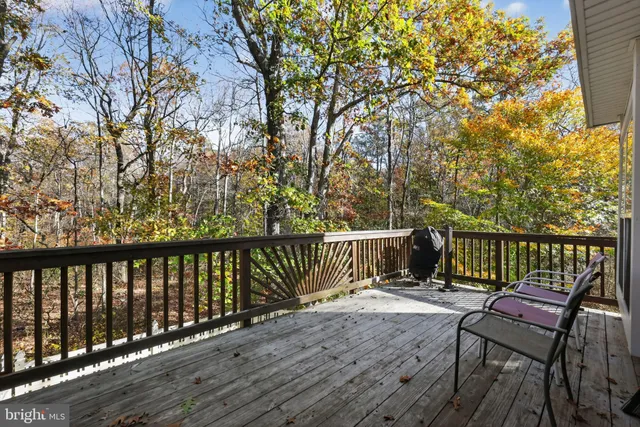 a view of a two chairs on the roof deck