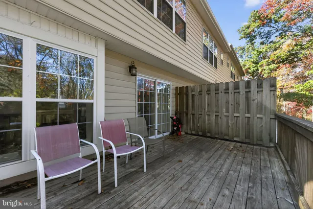 a view of a two chairs in the balcony