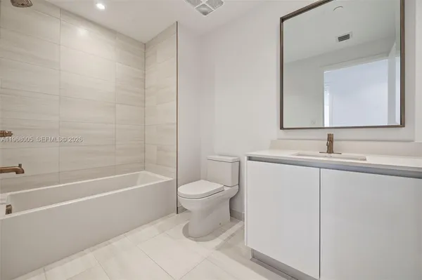 a view of a hallway with washer and dryer