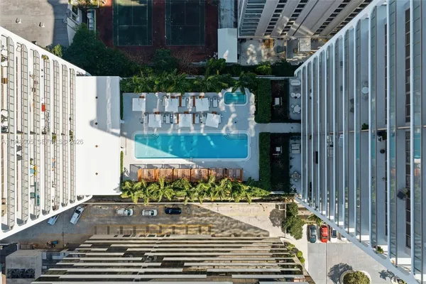 a building with view of tall trees