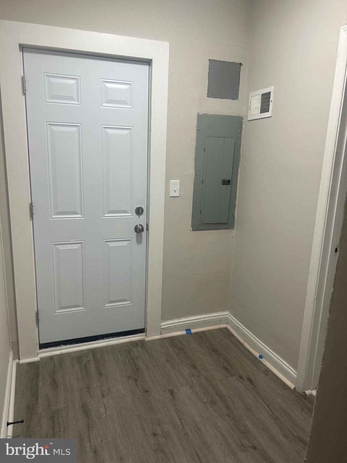 1823 Ramsay Street Baltimore, MD 21223 - Photo 12 of 13 an empty room with wooden floor and closet