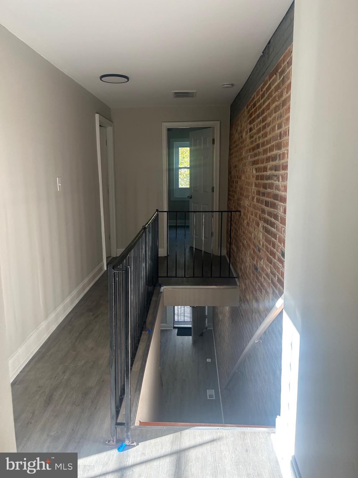 1823 Ramsay Street Baltimore, MD 21223 - Photo 9 of 13 a view of entryway and hall with wooden floor