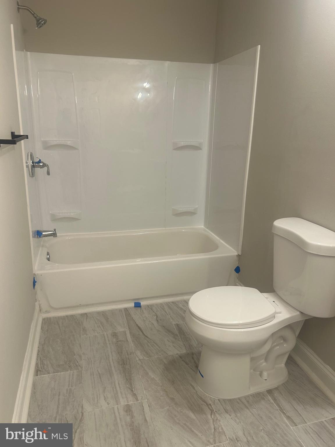 1823 Ramsay Street Baltimore, MD 21223 - Photo 10 of 13 a bathroom with a toilet and a shower