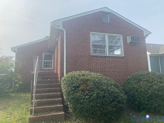 210 Maple Street Suffolk, VA 23434 - Photo 2 of 4 a view of house with stairs and yard