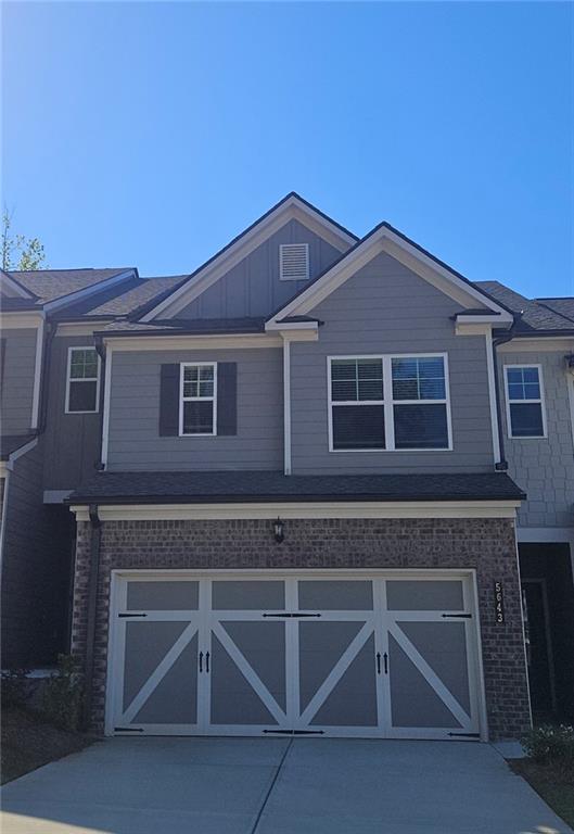 5629 Overview Drive Flowery Branch, GA 30542 - Photo 1 of 25 a front view of a house with plants